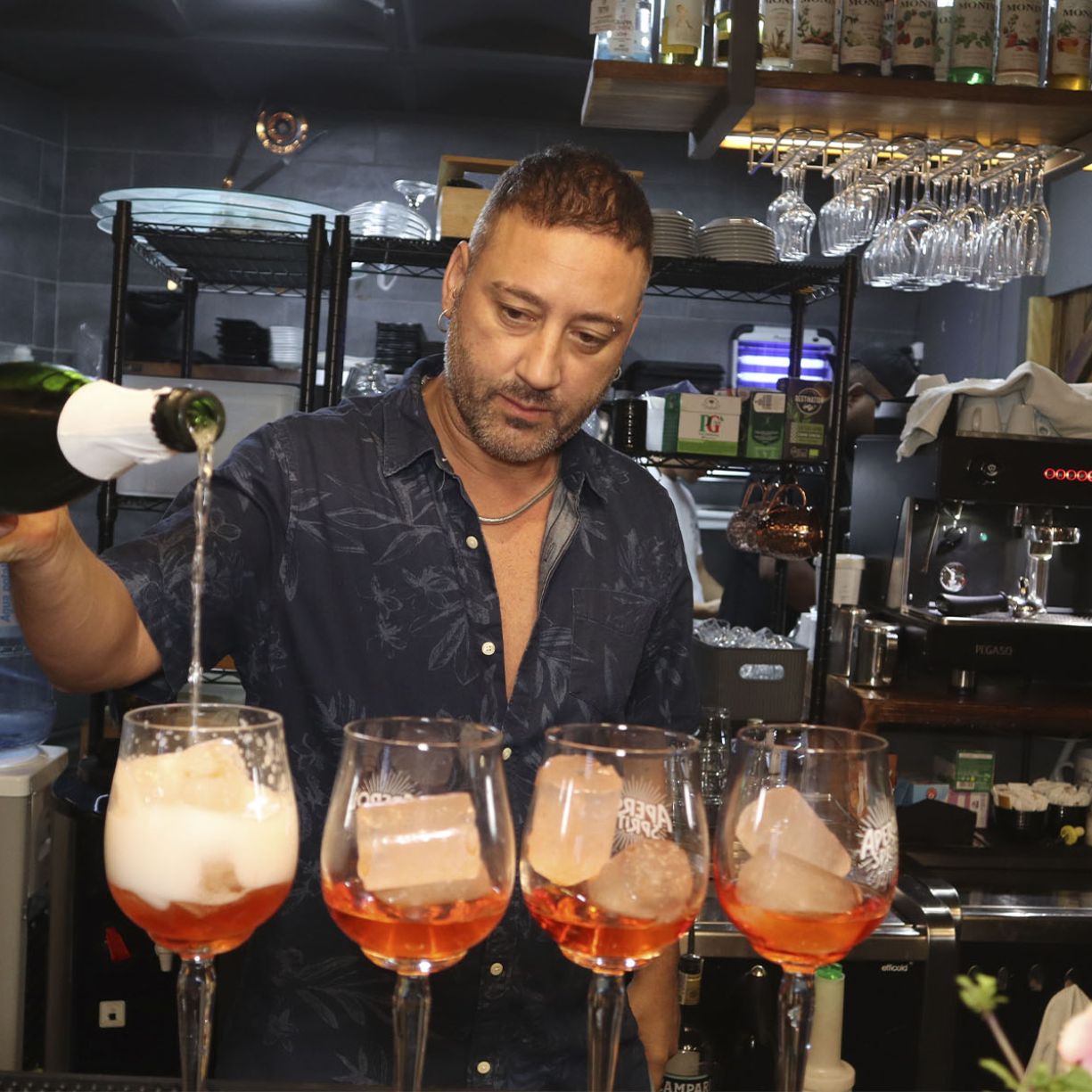 Litterio Cifalino serving drinks