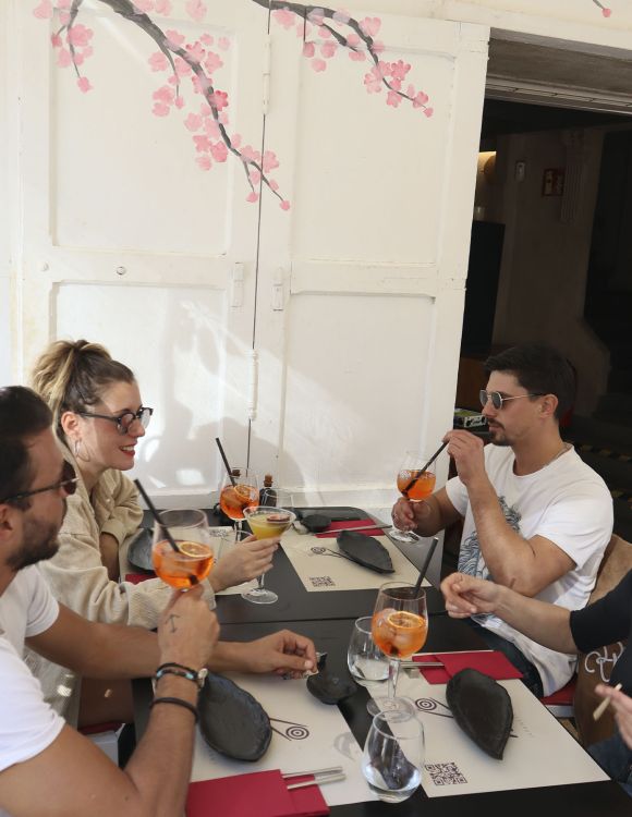 Customers enjoying drinks at Wakame Ibiza